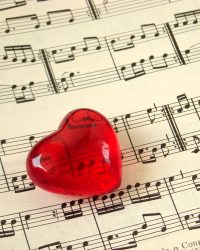 Close up of a music score and a red heart